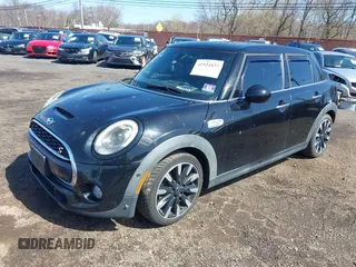 2017 MINI Hardtop 4 Door Cooper S z VIN WMWXU3C39H2F48699, wystawiony jako IAAI lot #41924423 z przebiegiem 81 249 mil mil oraz . Historia ofert i sprzedaży dostępna na DreamBid. Obrazek 19.
