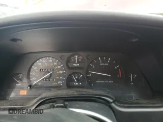 1996 Ford Thunderbird LX with VIN 1FALP62W7TH135632, listed as a Copart auction lot 77134024 with 128,931 mi miles and Salvage Title. Bid and sale history available at DreamBid. Image 9.