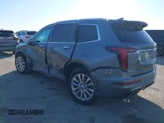 2020 Cadillac XT6 FWD Premium Luxury z VIN 1GYKPCRS8LZ129799, wystawiony jako IAAI lot #41602536 z przebiegiem 96 865 mil mil oraz . Historia ofert i sprzedaży dostępna na DreamBid. Obrazek 3.