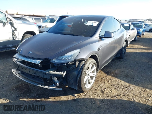 2021 Tesla Model Y Long Range with VIN 5YJYGDEE5MF191142, listed as a IAAI auction lot 41448514 with 71,626 mi miles. Bid and sale history available at carsss.com. Image 2.