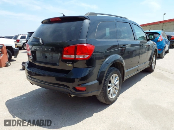 2015 Dodge Journey SXT with VIN 3C4PDCBG2FT718451, listed as a IAAI auction lot 42039821 with 198,695 mi miles and . Bid and sale history available at DreamBid. Image 4.