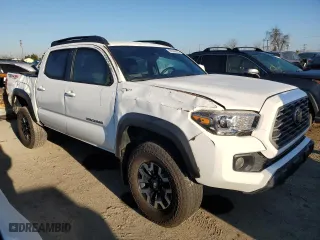 2023 Toyota Tacoma 4WD SR with VIN 3TMCZ5AN3PM618642, listed as a Copart auction lot 50386825 with 35,016 mi miles and Salvage Title. Bid and sale history available at carsss.com. Image 4.