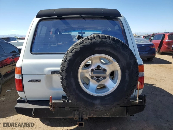 1997 Toyota Land Cruiser with VIN JT3HJ85J2V0180979, listed as a Copart auction lot 73216714 with 239,444 mi miles and Salvage Title. Bid and sale history available at carsss.com. Image 6.