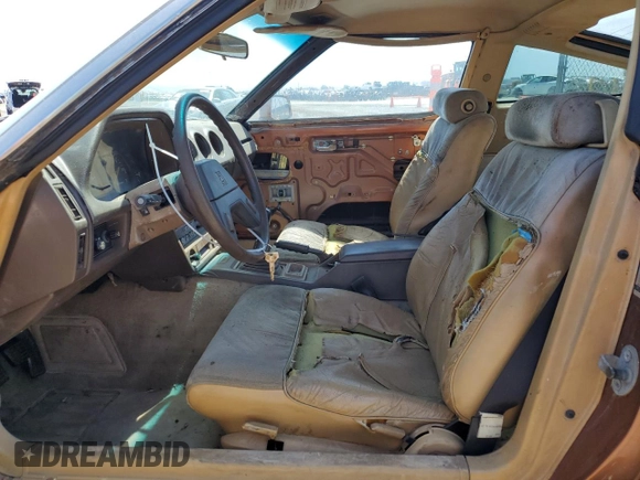 1982 Datsun 280ZX z VIN JN1HZ04S0CX433451, wystawiony jako Copart lot #53912864 z przebiegiem 200 629 mil mil oraz Tytuł czysty. Historia ofert i sprzedaży dostępna na DreamBid. Obrazek 7.