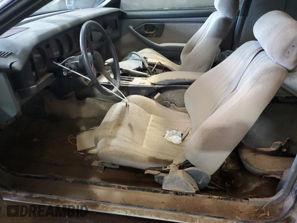 1987 Pontiac Firebird with VIN 1G2FS21S4HN213083, listed as a Copart auction lot 69101254 with 172,214 mi miles and Salvage title. Bid and sale history available at DreamBid. Image 7.