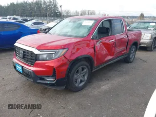 2022 Honda Ridgeline RTL-E with VIN 5FPYK3F74NB011358, listed as a IAAI auction lot 41431157 with 26,116 mi miles and . Bid and sale history available at DreamBid. Image 2.