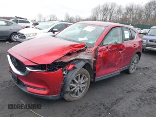2018 Mazda CX-5 Grand Touring with VIN JM3KFBDM0J0427753, listed as a IAAI auction lot 41740838 with 69,683 mi miles and . Bid and sale history available at DreamBid. Image 2.