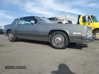 1985 Cadillac Eldorado z VIN 1G6EL5786FE628861, wystawiony jako Copart lot #76372384 z przebiegiem 15 146 mil mil oraz Szkody całkowita. Historia ofert i sprzedaży dostępna na DreamBid. Obrazek 4.