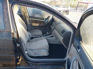 2008 Volkswagen Rabbit S with VIN WVWDB71KX8W331634, listed as a IAAI auction lot 41822205 with 176,502 mi miles. Bid and sale history available at carsss.com. Image 5.