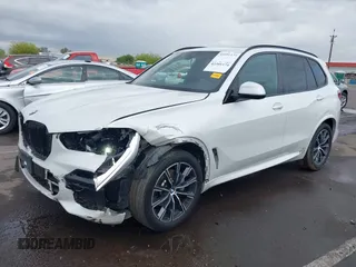 2020 BMW X5 sDrive40i with VIN 5UXCR4C04L9D41635, listed as a IAAI auction lot 42201174 with 64,989 mi miles and . Bid and sale history available at DreamBid. Image 2.