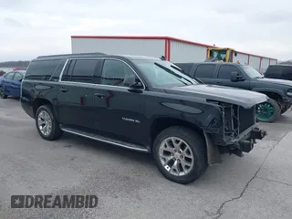 2015 GMC Yukon XL SLT with VIN 1GKS2HKC6FR746809, listed as a IAAI auction lot 41559570 with 144,401 mi miles. Bid and sale history available at carsss.com. Image 1.