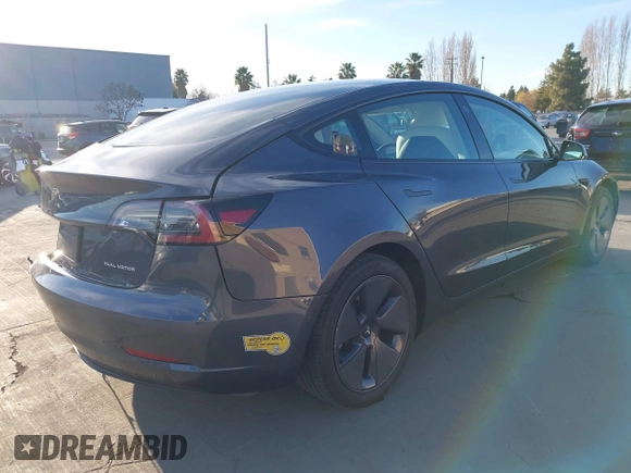 2022 Tesla Model 3 Long Range with VIN 5YJ3E1EB4NF293635, listed as a IAAI auction lot 41388234 with 28,396 mi miles and . Bid and sale history available at DreamBid. Image 4.