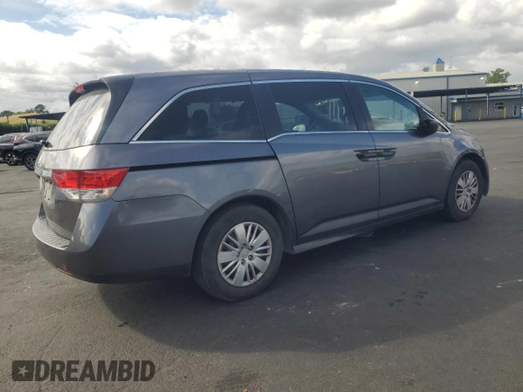 2015 Honda Odyssey LX with VIN 5FNRL5H27FB018491, listed as a Copart auction lot 54888445 with 129,488 mi miles and Salvage Title. Bid and sale history available at DreamBid. Image 3.