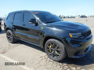 2020 Jeep Grand Cherokee Trackhawk with VIN 1C4RJFN96LC336561, listed as a IAAI auction lot 41991800 with 58,781 mi miles and . Bid and sale history available at DreamBid. Image 1.