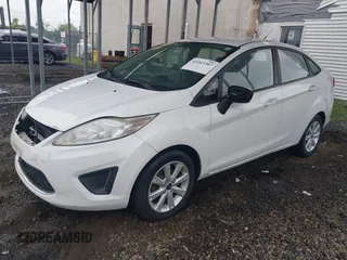2011 Ford Fiesta SE z VIN 3FADP4BJ5BM207676, wystawiony jako IAAI lot #42263307 z przebiegiem 139 929 mil mil oraz . Historia ofert i sprzedaży dostępna na DreamBid. Obrazek 2.
