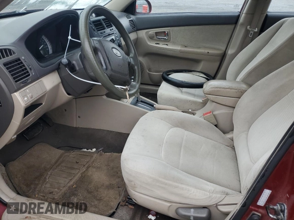 2007 Kia Spectra EX with VIN KNAFE121X75381938, listed as a Copart auction lot 74341004 with 118,890 mi miles and Salvage Title. Bid and sale history available at carsss.com. Image 7.