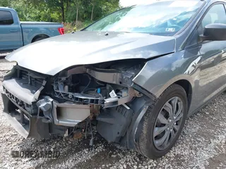 2012 Ford Focus SE with VIN 1FAHP3F29CL310052, listed as a IAAI auction lot 42671578 with 220,537 mi miles and . Bid and sale history available at DreamBid. Image 13.