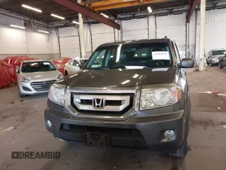 2011 Honda Pilot EX-L with VIN 5FNYF4H65BB020721, listed as a IAAI auction lot 41794436 with 113,630 mi miles and . Bid and sale history available at carsss.com. Image 12.