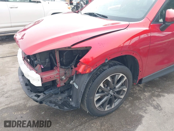 2016 Mazda CX-5 Grand Touring with VIN JM3KE4DY9G0865780, listed as a IAAI auction lot 41913914 with 76,579 mi miles. Bid and sale history available at carsss.com. Image 6.