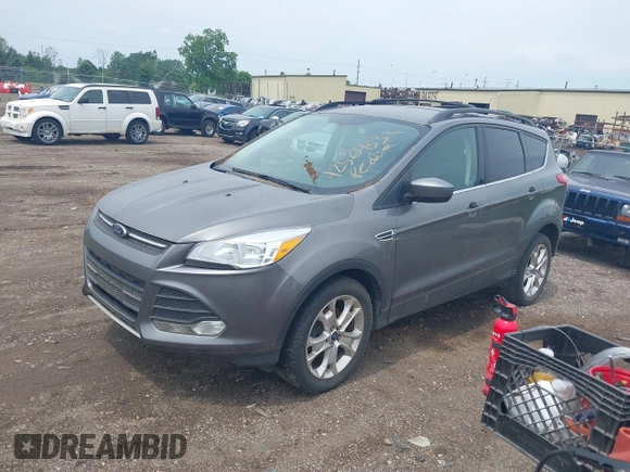 2013 Ford Escape SE with VIN 1FMCU0GX2DUA31362, listed as a IAAI auction lot 42564337 with 157,737 mi miles and . Bid and sale history available at DreamBid. Image 2.
