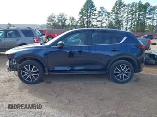 2018 Mazda CX-5 Touring z VIN JM3KFACM0J1389057, wystawiony jako IAAI lot #40922679 z przebiegiem 140 026 mil mil oraz . Historia ofert i sprzedaży dostępna na DreamBid. Obrazek 15.