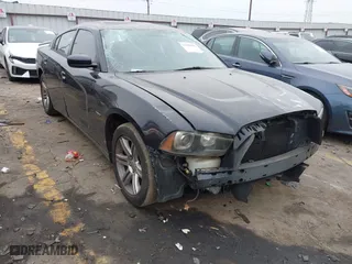 2011 Dodge Charger RT Plus with VIN 2B3CL5CT7BH521577, listed as a IAAI auction lot 41388986 with 135,009 mi miles. Bid and sale history available at carsss.com. Image 1.