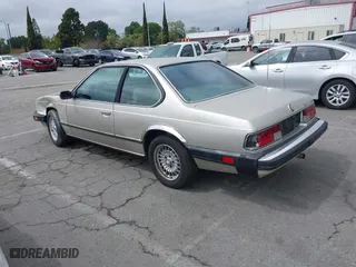 1985 BMW 6 Series 635CSi with VIN WBAEC8400F0610637, listed as a IAAI auction lot 41935412 with 129,943 mi miles. Bid and sale history available at carsss.com. Image 3.