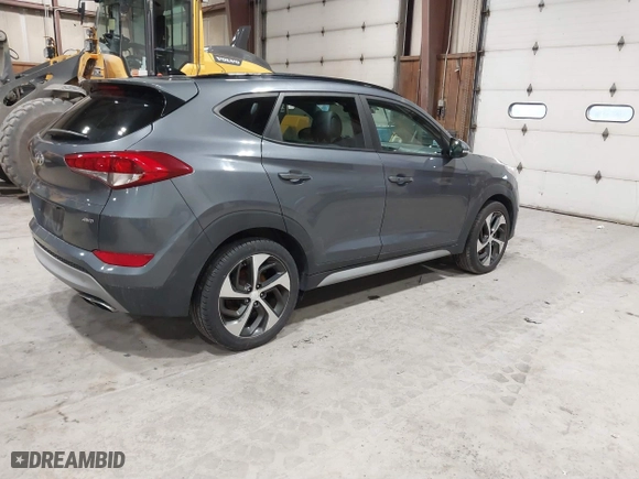 2018 Hyundai Tucson Value with VIN KM8J3CA22JU688957, listed as a IAAI auction lot 41868195 with 117,256 mi miles. Bid and sale history available at carsss.com. Image 4.