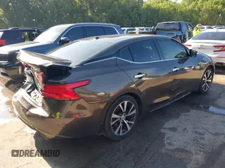 2016 Nissan Maxima Platinum z VIN 1N4AA6AP3GC385276, wystawiony jako IAAI lot #42547410 z przebiegiem 100 307 mil mil oraz . Historia ofert i sprzedaży dostępna na DreamBid. Obrazek 4.