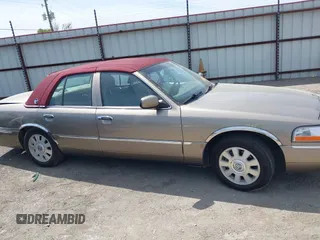 2004 Mercury Grand Marquis LS Premium z VIN 2MEFM75W34X674542, wystawiony jako IAAI lot #42018186 z przebiegiem 137 944 mil mil oraz . Historia ofert i sprzedaży dostępna na DreamBid. Obrazek 14.