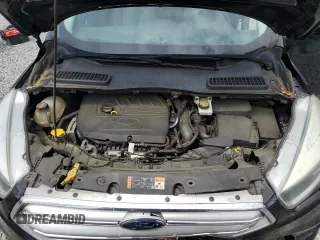 2017 Ford Escape SE z VIN 1FMCU0GD7HUA94744, wystawiony jako Copart lot #54209545 z przebiegiem 99 658 mil mil oraz Szkoda całkowita • Salvage title. Historia ofert i sprzedaży dostępna na DreamBid. Obrazek 11.