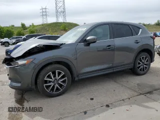2018 Mazda CX-5 Touring z VIN JM3KFBCM2J0379190, wystawiony jako Copart lot #59233075 z przebiegiem 51 985 mil mil oraz Szkoda całkowita • Salvage title. Historia ofert i sprzedaży dostępna na DreamBid. Obrazek 1.