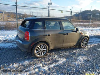 2013 MINI Cooper Countryman with VIN WMWZB3C58DWM31146, listed as a IAAI auction lot 41423661 with 97,505 mi miles. Bid and sale history available at carsss.com. Image 4.