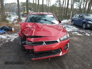 2016 Mitsubishi Lancer SE with VIN JA32V2FW7GU004159, listed as a IAAI auction lot 41401386 with 100,536 mi miles. Bid and sale history available at carsss.com. Image 6.