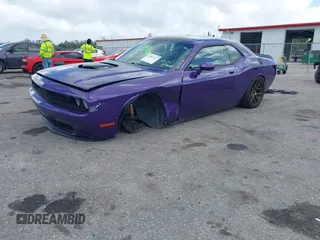 2016 Dodge Challenger R/T Plus Shaker z VIN 2C3CDZBTXGH191823, wystawiony jako IAAI lot #41881157 z przebiegiem 98 577 mil mil oraz . Historia ofert i sprzedaży dostępna na DreamBid. Obrazek 2.