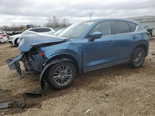 2017 Mazda CX-5 Touring z VIN JM3KFBCL2H0129000, wystawiony jako Copart lot #52107005 z przebiegiem 55 411 mil mil oraz Szkody całkowita. Historia ofert i sprzedaży dostępna na DreamBid. Obrazek 1.