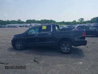 2023 Honda Ridgeline RTL-E with VIN 5FPYK3F71PB022739, listed as a IAAI auction lot 42447428 with 19,702 mi miles and . Bid and sale history available at DreamBid. Image 14.