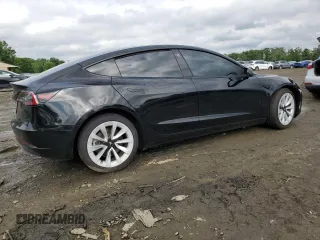2023 Tesla Model 3 with VIN 5YJ3E1EA3PF451764, listed as a Copart auction lot 58718705 with 33,965 mi miles and Salvage title. Bid and sale history available at DreamBid. Image 3.