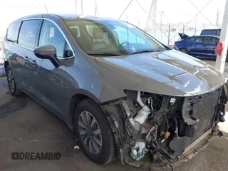 2023 Chrysler Pacifica Hybrid Touring L with VIN 2C4RC1L73PR509853, listed as a IAAI auction lot 41690872 with 83,014 mi miles and . Bid and sale history available at DreamBid. Image 1.