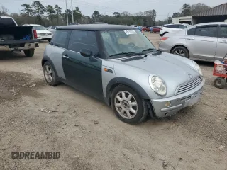 2004 MINI Hardtop with VIN WMWRC33424TJ63121, listed as a Copart auction lot 45724105 with 215,449 mi miles and Salvage Title. Bid and sale history available at DreamBid. Image 4.