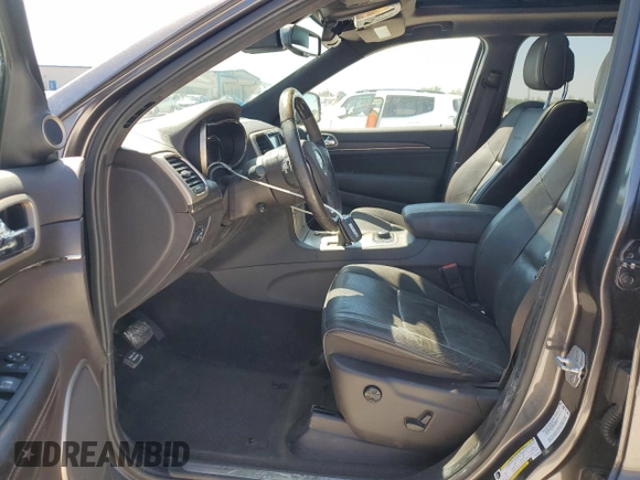2014 Jeep Grand Cherokee Summit with VIN 1C4RJFJGXEC159438, listed as a Copart auction lot 50864595 with 134,558 mi miles and Salvage title. Bid and sale history available at DreamBid. Image 7.