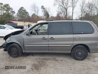 2005 Kia Sedona LX with VIN KNDUP132056674430, listed as a IAAI auction lot 41553321 with 136,734 mi miles. Bid and sale history available at carsss.com. Image 14.