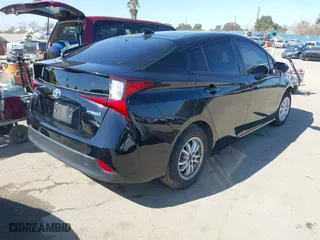 2021 Toyota Prius L Eco with VIN JTDKAMFU3M3148574, listed as a IAAI auction lot 41624303 with 89,747 mi miles. Bid and sale history available at carsss.com. Image 4.