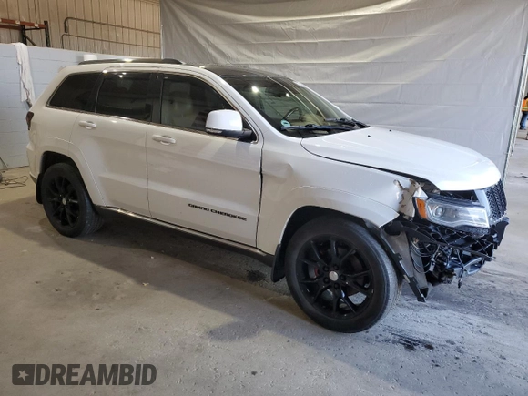 2015 Jeep Grand Cherokee Summit with VIN 1C4RJFJG1FC226591, listed as a Copart auction lot 52926115 with 130,803 mi miles and Salvage Title. Bid and sale history available at DreamBid. Image 4.
