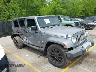 2016 Jeep Wrangler Unlimited Sahara with VIN 1C4HJWEG3GL202803, listed as a IAAI auction lot 42199735 with 96,887 mi miles and . Bid and sale history available at DreamBid. Image 1.