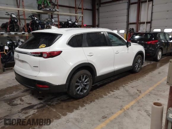 2022 Mazda CX-9 Sport z VIN JM3TCBBYXN0603653, wystawiony jako IAAI lot #42325893 z przebiegiem 57 480 mil mil oraz . Historia ofert i sprzedaży dostępna na DreamBid. Obrazek 4.