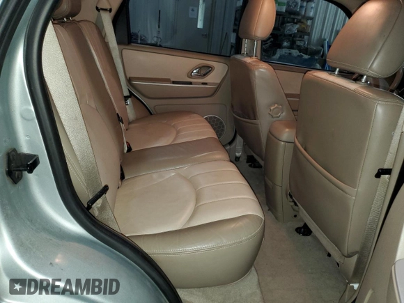 2005 Mercury Mariner Luxury z VIN 4M2CU57135DJ00228, wystawiony jako Copart lot #87603775 z przebiegiem 169 099 mil mil oraz Szkody całkowita. Historia ofert i sprzedaży dostępna na DreamBid. Obrazek 12.
