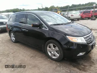 2012 Honda Odyssey Touring with VIN 5FNRL5H97CB066596, listed as a IAAI auction lot 42472935 with 217,182 mi miles and . Bid and sale history available at DreamBid. Image 1.