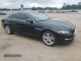 2017 Jaguar XJ with VIN SAJWA1C73H8W10544, listed as a Copart auction lot 70025724 with 64,437 mi miles and Salvage Title. Bid and sale history available at carsss.com. Image 4.
