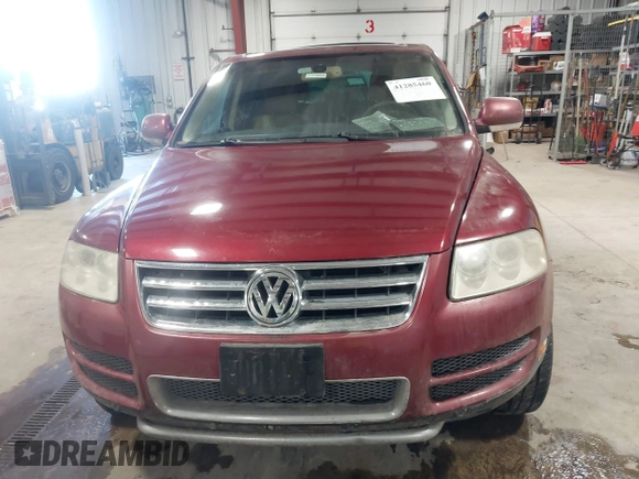 2004 Volkswagen Touareg z VIN WVGCM67LX4D038012, wystawiony jako IAAI lot #41285460 z przebiegiem Nie podano mil oraz . Historia ofert i sprzedaży dostępna na DreamBid. Obrazek 6.